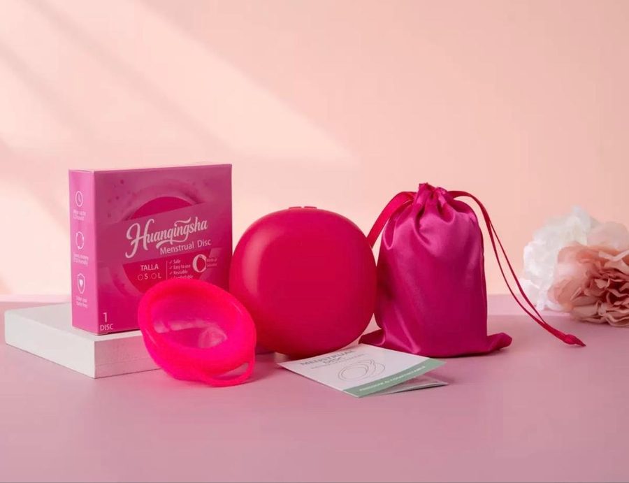 JULLYBESTY menstrual disc in rose red with its storage case, satin pouch and instruction manual